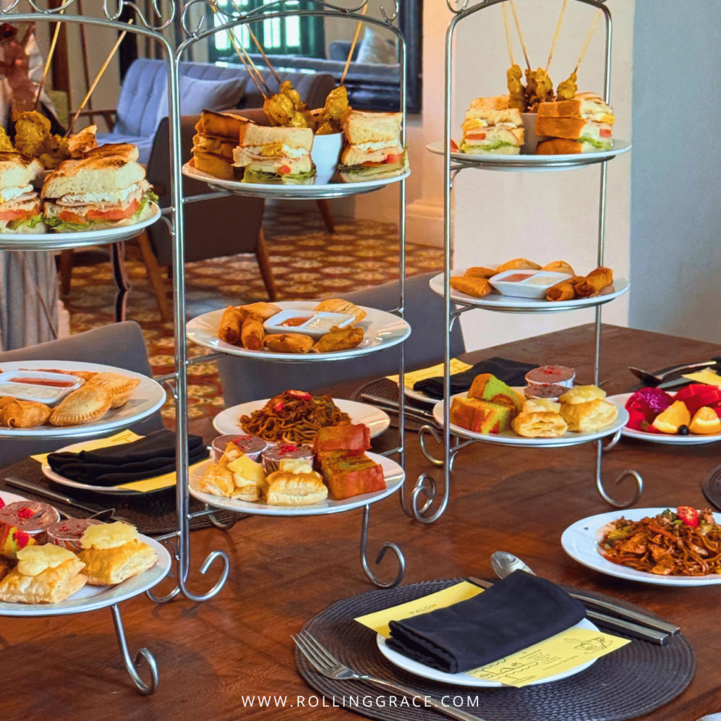 Tiered stands of sandwiches, pastries and fruit laid out for a gathering at the Colonial House, Temple Tree Resort Langkawi