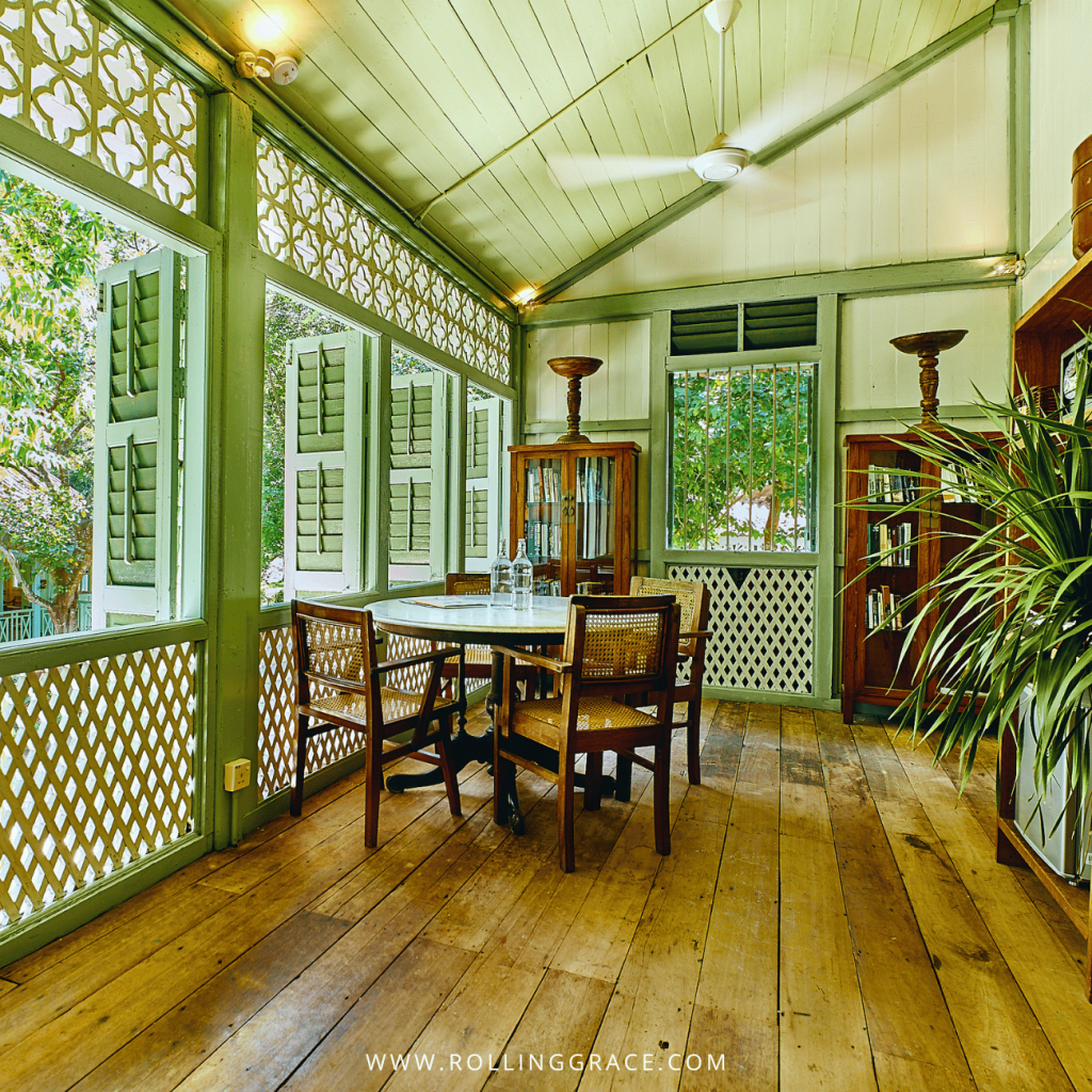 Dining table on the shuttered timber veranda of the Colonial House grand suite, Temple Tree Resort Langkawi