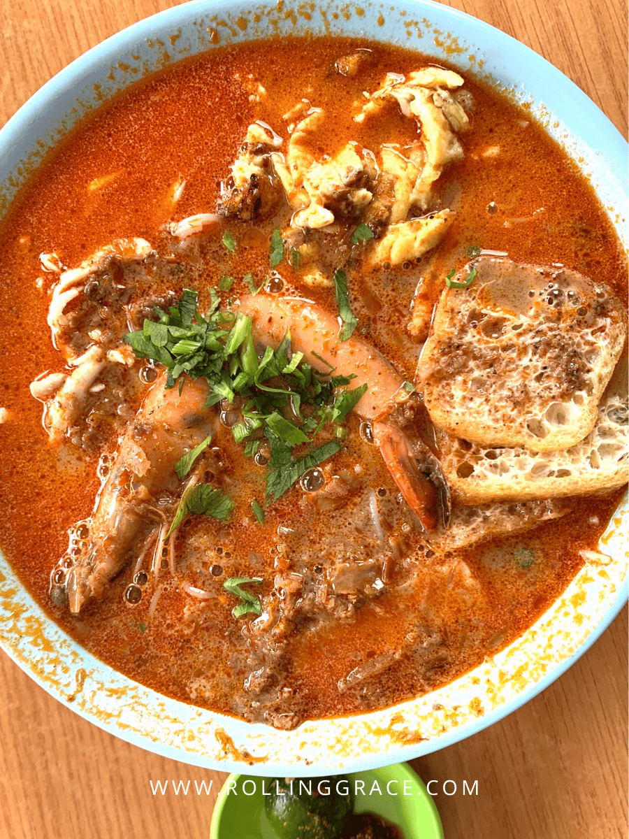 Bowl of Sarawak laksa with prawns and sambal, a must-try food among things to do in Miri