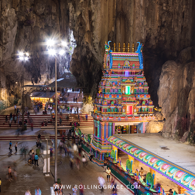 Colourful temple tower inside the Temple Cave at Batu Caves, Malaysia, beneath a high limestone ceiling