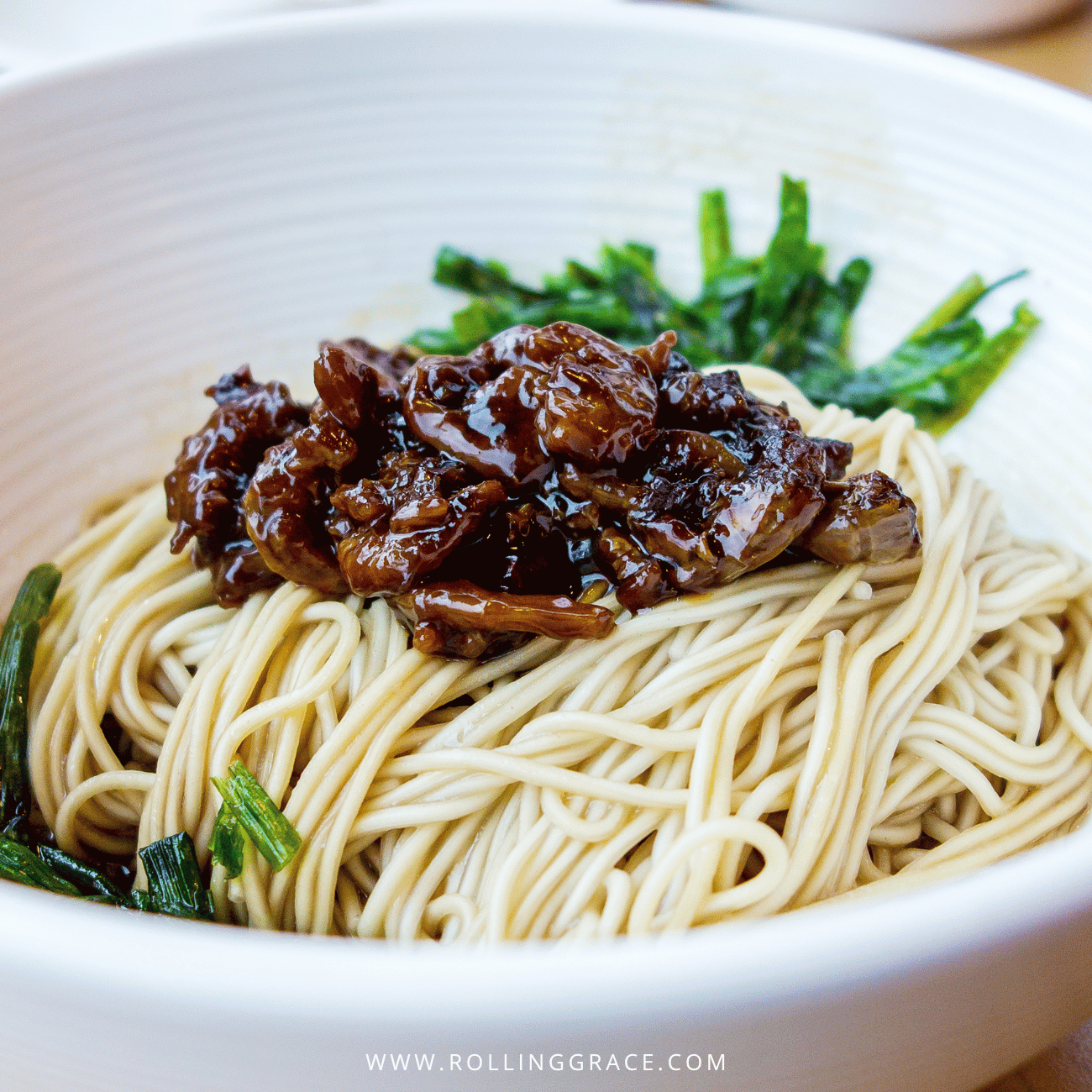 Beitou Food: 9 Best Places to Eat in Beitou, Taipei 5 Jian Ji pork rib noodles in Beitou, Taipei, dry noodles topped with braised pork and leafy greens