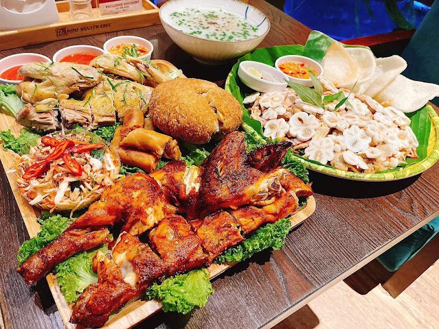 Vietnamese sharing platter with grilled chicken, spring rolls, herbs and dipping sauces at Mimi Nguyen Café, Klang