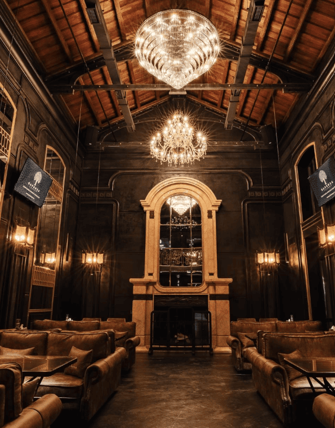 Wood-panelled hall with crystal chandeliers and leather armchairs at Barvikha Lounge, Baumanskaya, shisha in Moscow
