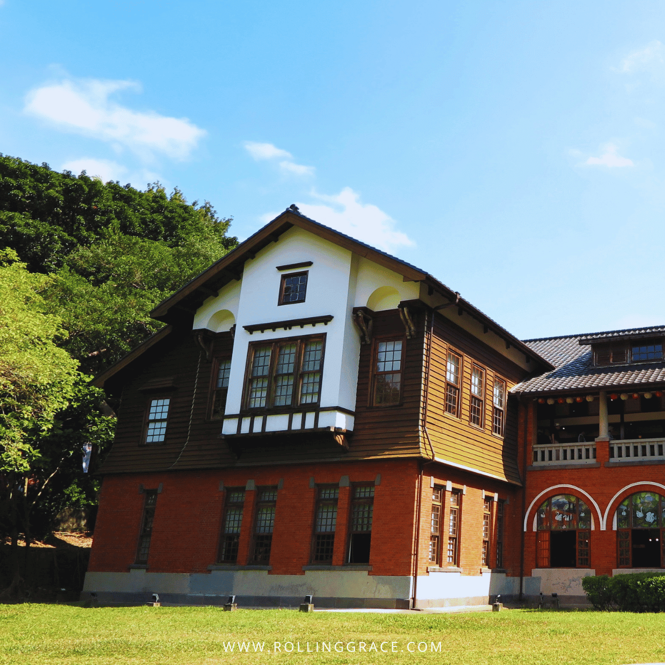 14 Things to Do in Beitou, Taipei: Best Hot Springs & Parks 5 Beitou Hot Spring Museum in Beitou, Taipei, a red brick and timber Tudor-style bathhouse under a blue sky