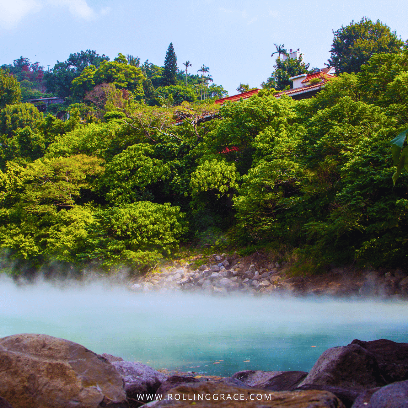 14 Things to Do in Beitou, Taipei: Best Hot Springs & Parks 3 Beitou Park Outdoor Hot Spring Bathing Pool in Beitou, Taipei, with steaming turquoise water below a green hillside