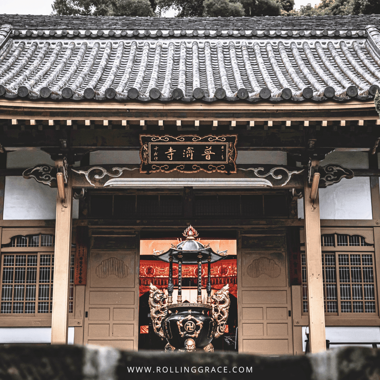 14 Things to Do in Beitou, Taipei: Best Hot Springs & Parks 8 Puji Temple in Beitou, Taipei, a Japanese-style wooden temple front with a carved name board and incense burner